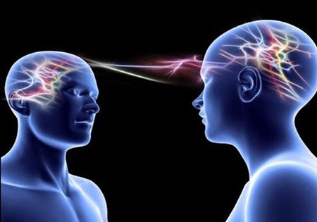 Computer generated image of two individuals communicating by sending neural signals to each other's brain